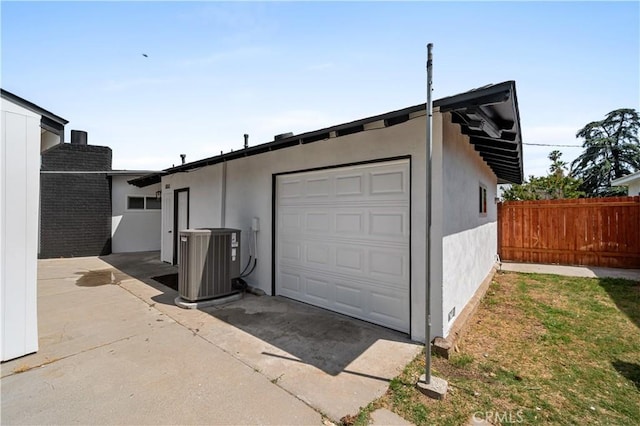 424 E Victoria St, Rialto, CA 92376 - garage featuring central air condition unit