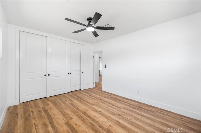 424 E Victoria St, Rialto, CA 92376 - unfurnished bedroom featuring baseboards, light wood finished floors, a closet, and a ceiling fan