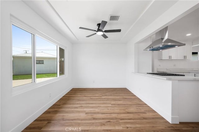 424 E Victoria St, Rialto, CA 92376 - unfurnished dining area featuring a ceiling fan, baseboards, and light wood-style floors