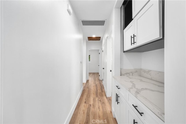 424 E Victoria St, Rialto, CA 92376 - hallway featuring light wood-style floors and baseboards