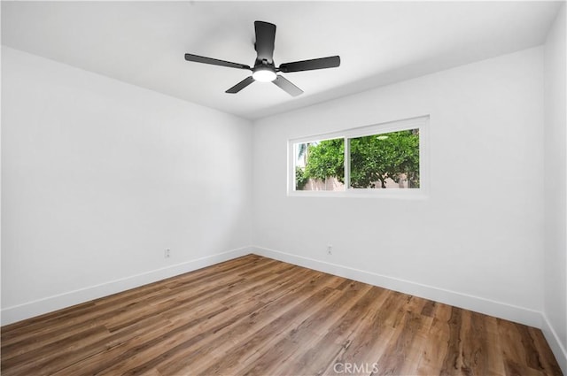 424 E Victoria St, Rialto, CA 92376 - spare room with baseboards, wood finished floors, and ceiling fan