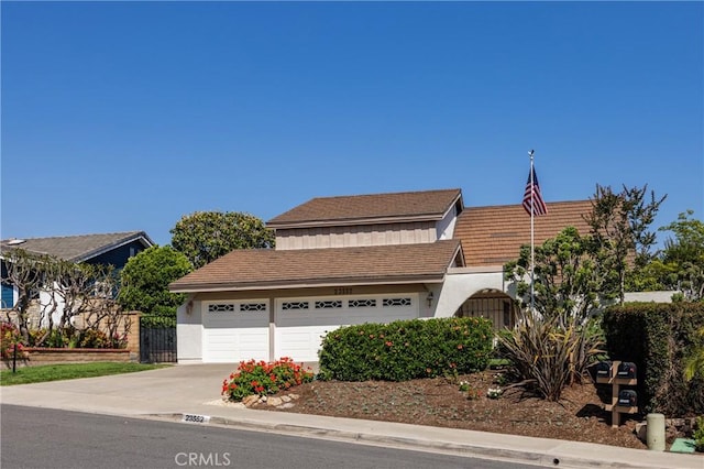23552 Campestre, Mission Viejo, CA 92691 - view of front of house with concrete driveway, stucco siding, and a garage