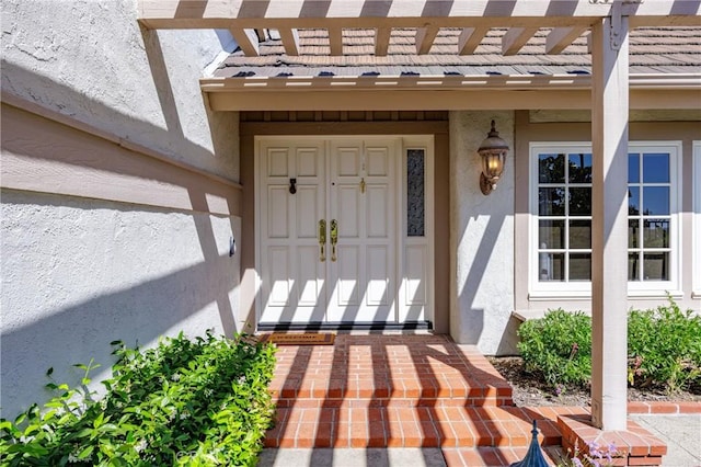 23552 Campestre, Mission Viejo, CA 92691 - view of exterior entry featuring stucco siding, a pergola, and a tiled roof