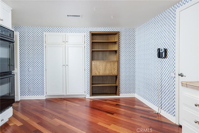 23552 Campestre, Mission Viejo, CA 92691 - unfurnished bedroom featuring wallpapered walls, baseboards, and wood finished floors
