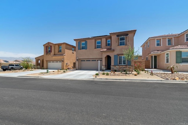 35404 Domani Dr, Palm Desert, CA 92211 - view of front of house featuring a garage, stucco siding, concrete driveway, and a tile roof
