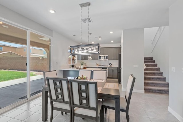 35404 Domani Dr, Palm Desert, CA 92211 - dining room featuring light tile patterned floors, stairway, and recessed lighting