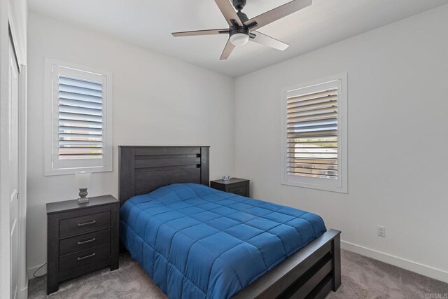35404 Domani Dr, Palm Desert, CA 92211 - bedroom featuring light colored carpet and ceiling fan