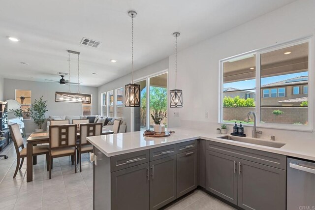 35404 Domani Dr, Palm Desert, CA 92211 - kitchen with stainless steel dishwasher, ceiling fan, gray cabinetry, light countertops, and recessed lighting
