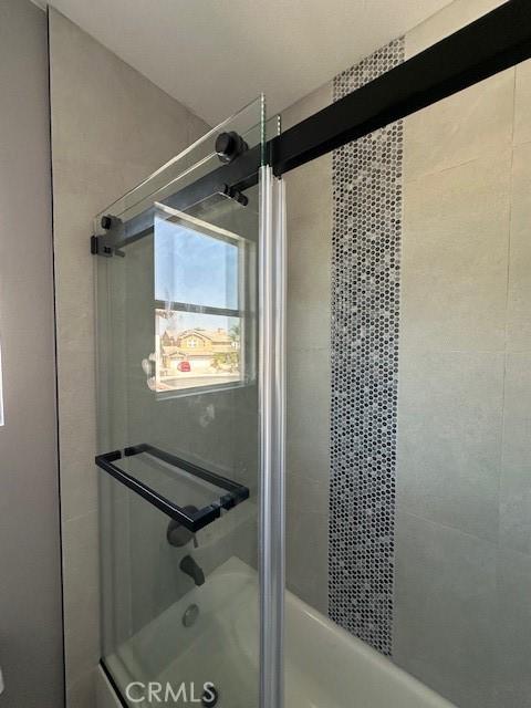 13531 Shallow Brook Ct, Eastvale, CA 92880 - bathroom featuring enclosed tub / shower combo
