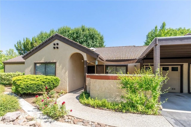 9 Coolwater, Chico, CA 95928 - view of front of house with a tile roof, stucco siding, and driveway