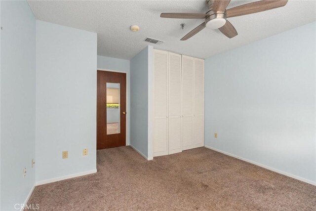 9 Coolwater, Chico, CA 95928 - unfurnished bedroom with carpet floors, a closet, a ceiling fan, and a textured ceiling