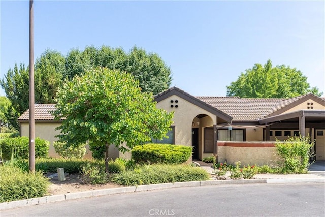 9 Coolwater, Chico, CA 95928 - view of front of property featuring a tile roof, stucco siding, and a garage