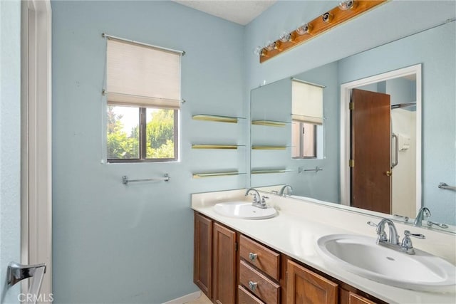 9 Coolwater, Chico, CA 95928 - full bathroom featuring double vanity and baseboards