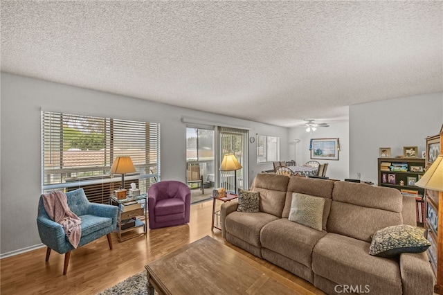 5359 Algarrobo Unit 1A, Laguna Woods, CA 92637 - living room with wood finished floors, a textured ceiling, and a ceiling fan