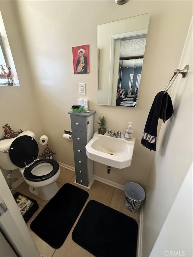 4535 Ramsdell Ave, La Crescenta, CA 91214 - half bath with tile patterned floors, toilet, and a sink