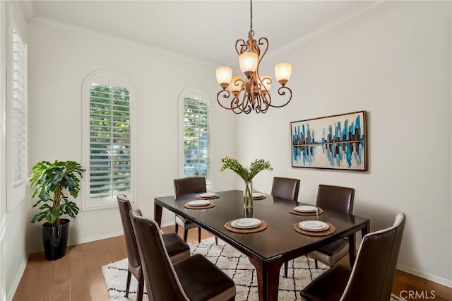 28523 Santa Catarina Rd, Saugus, CA 91350 - dining room with a chandelier, ornamental molding, baseboards, and wood finished floors