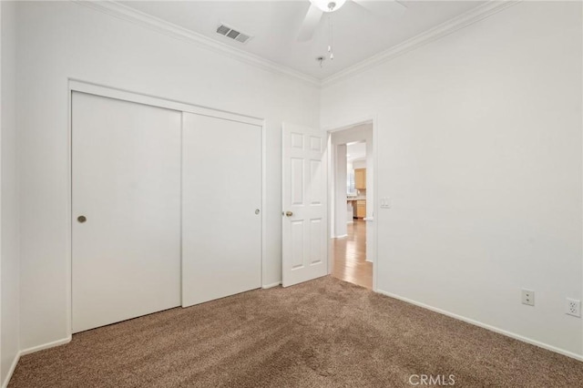 28523 Santa Catarina Rd, Saugus, CA 91350 - unfurnished bedroom with carpet floors, ornamental molding, a closet, a ceiling fan, and baseboards