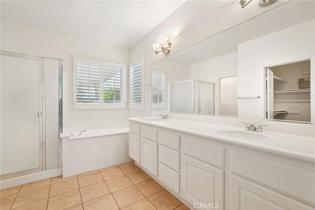 28523 Santa Catarina Rd, Saugus, CA 91350 - full bathroom with a shower stall, a bath, double vanity, tile patterned flooring, and a spacious closet