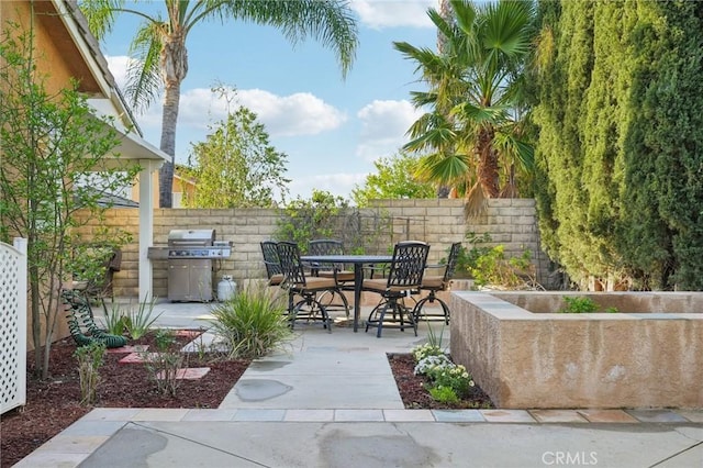 28523 Santa Catarina Rd, Saugus, CA 91350 - view of patio featuring a grill and outdoor dining area