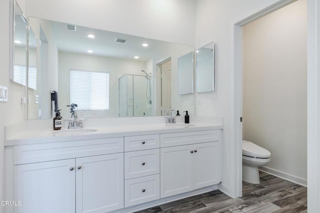 1607 Dundas Pl, Upland, CA 91784 - full bath featuring a shower stall, double vanity, toilet, wood finished floors, and recessed lighting