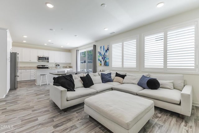 1607 Dundas Pl, Upland, CA 91784 - living area featuring light wood-style floors and recessed lighting