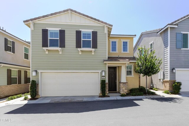 1607 Dundas Pl, Upland, CA 91784 - view of front facade featuring a garage and driveway