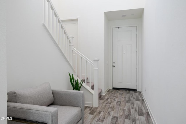 1607 Dundas Pl, Upland, CA 91784 - foyer entrance featuring stairway, wood finished floors, and baseboards