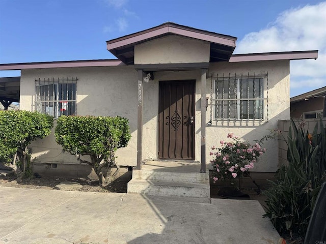 704 J St, Chula Vista, CA 91910 - property entrance featuring stucco siding