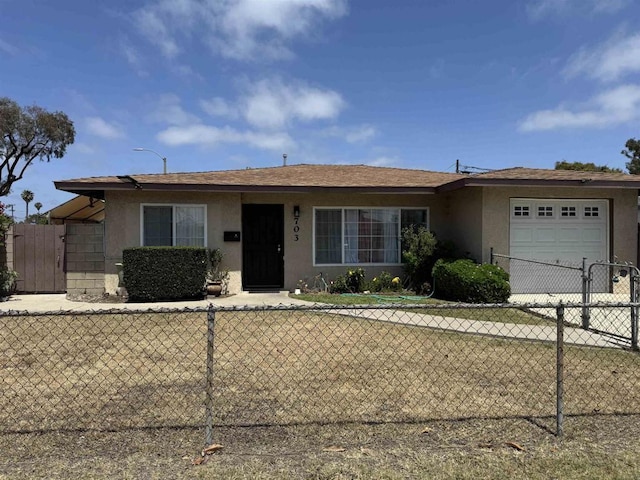 704 J St, Chula Vista, CA 91910 - ranch-style house featuring an attached garage, stucco siding, and concrete driveway