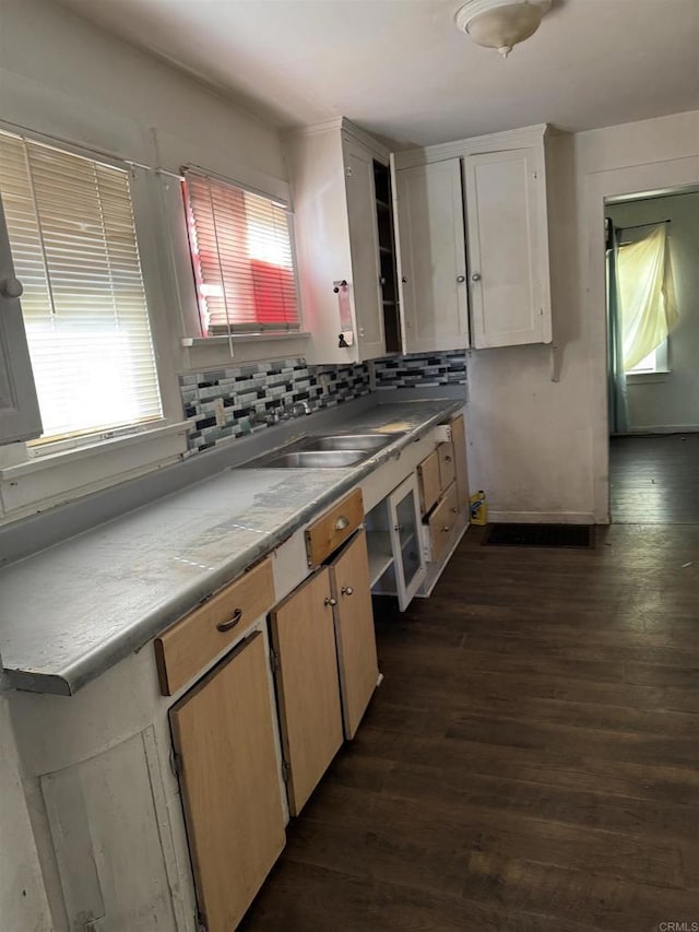 704 J St, Chula Vista, CA 91910 - kitchen with dark wood finished floors, backsplash, a sink, and light countertops