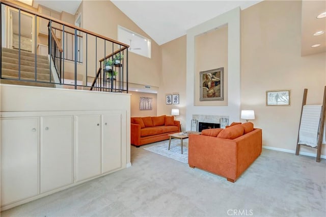 14096 Baker St, Westminster, CA 92683 - carpeted living room with high vaulted ceiling, stairs, a premium fireplace, baseboards, and recessed lighting
