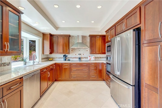14096 Baker St, Westminster, CA 92683 - kitchen with stainless steel appliances, wall chimney range hood, a sink, light stone counters, and tasteful backsplash
