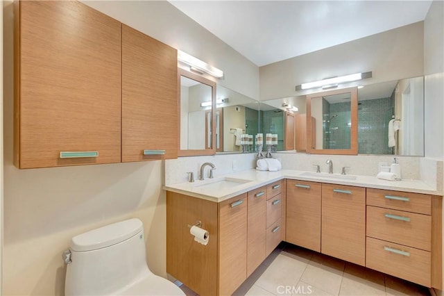14096 Baker St, Westminster, CA 92683 - bathroom featuring double vanity, a shower stall, toilet, and tile patterned flooring