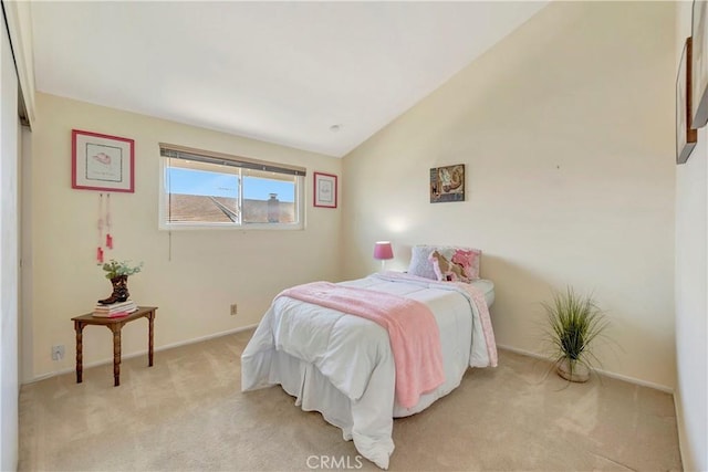 14096 Baker St, Westminster, CA 92683 - bedroom with light carpet, lofted ceiling, and baseboards