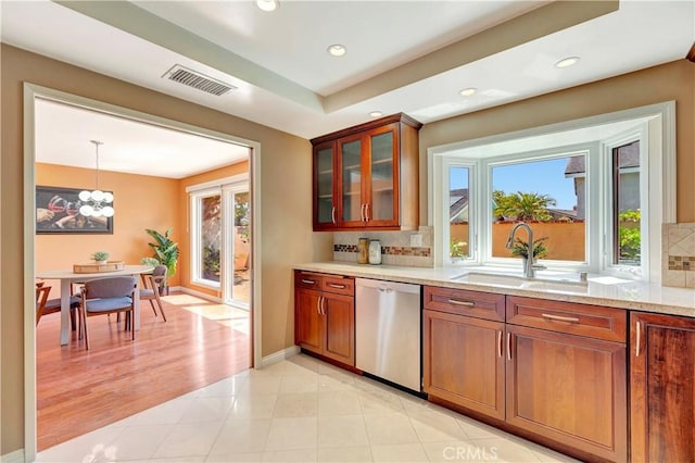 14096 Baker St, Westminster, CA 92683 - kitchen with stainless steel dishwasher, a sink, healthy amount of natural light, tasteful backsplash, and recessed lighting