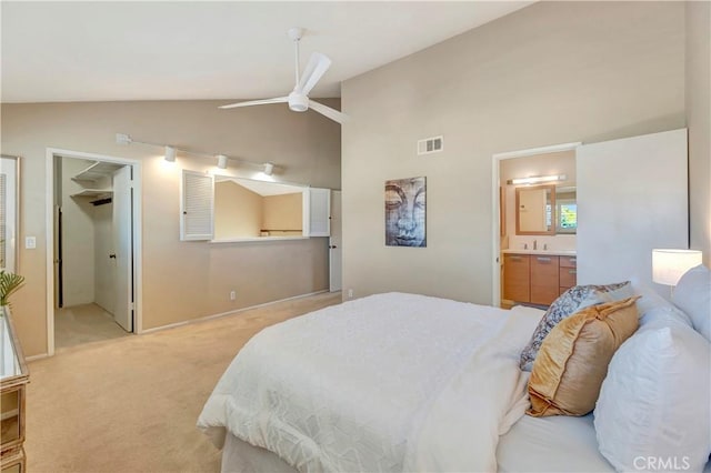 14096 Baker St, Westminster, CA 92683 - bedroom with vaulted ceiling, light colored carpet, connected bathroom, and ceiling fan