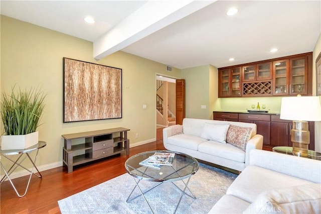 14096 Baker St, Westminster, CA 92683 - living area featuring wood finished floors, stairs, baseboards, beam ceiling, and recessed lighting