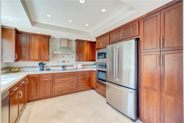 14096 Baker St, Westminster, CA 92683 - kitchen with stainless steel appliances, wall chimney exhaust hood, a raised ceiling, recessed lighting, and tasteful backsplash