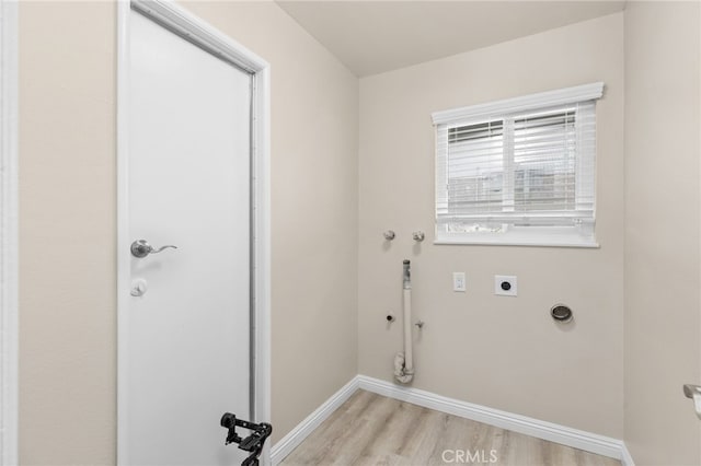 26331 Foxgrove Rd, Menifee, CA 92586 - laundry area featuring electric dryer hookup, light wood-style flooring, and baseboards
