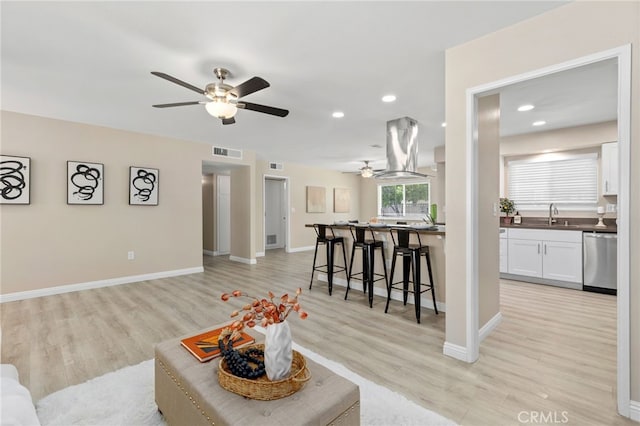26331 Foxgrove Rd, Menifee, CA 92586 - living room featuring a ceiling fan, light wood-style floors, recessed lighting, and baseboards