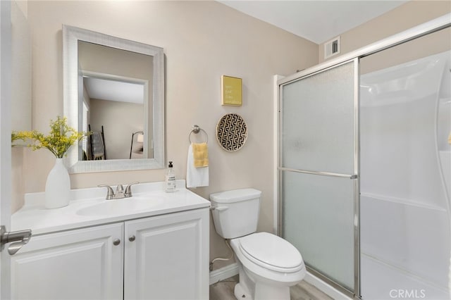 26331 Foxgrove Rd, Menifee, CA 92586 - bathroom featuring vanity, a shower stall, and toilet