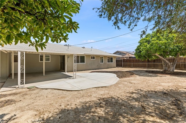26331 Foxgrove Rd, Menifee, CA 92586 - back of property with stucco siding and a patio