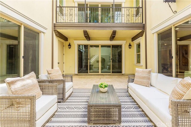 51 Dunmore, Irvine, CA 92620 - view of patio featuring an outdoor hangout area and a balcony
