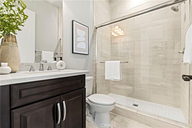 51 Dunmore, Irvine, CA 92620 - bathroom with toilet, a shower stall, vanity, and tile patterned floors