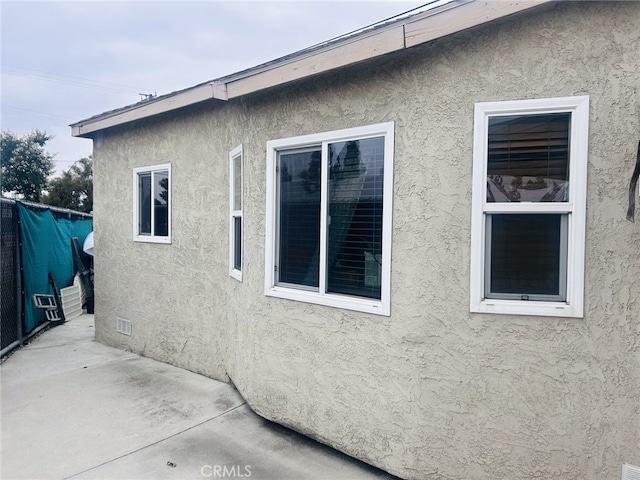 15160 Pimenta Ave, Paramount, CA 90723 - view of home's exterior with stucco siding and a patio area