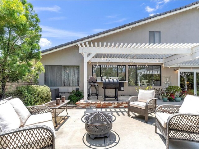23403 Via Castanet, Valencia, CA 91355 - view of patio with an outdoor living space with a fire pit, a pergola, area for grilling, and central air condition unit