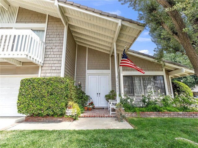 23403 Via Castanet, Valencia, CA 91355 - view of exterior entry featuring a yard