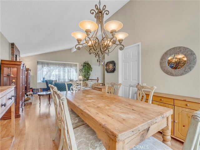 23403 Via Castanet, Valencia, CA 91355 - dining room featuring light wood finished floors, a chandelier, and high vaulted ceiling