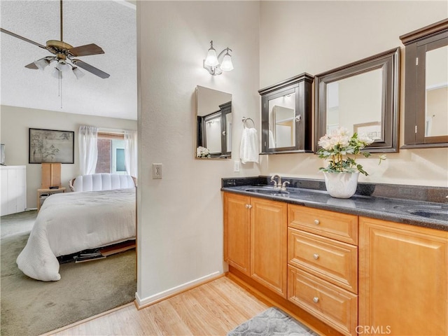 23403 Via Castanet, Valencia, CA 91355 - ensuite bathroom with ceiling fan, wood finished floors, double vanity, and lofted ceiling