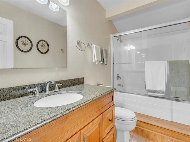 23403 Via Castanet, Valencia, CA 91355 - bathroom with toilet, vanity, bath / shower combo with glass door, and wood finished floors